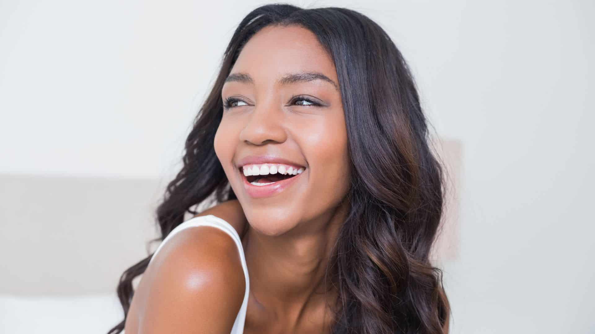 Smiling patient highlighting retainer care after orthodontic treatment at Dr. B Smiles Orthodontics in Wappingers Falls, NY